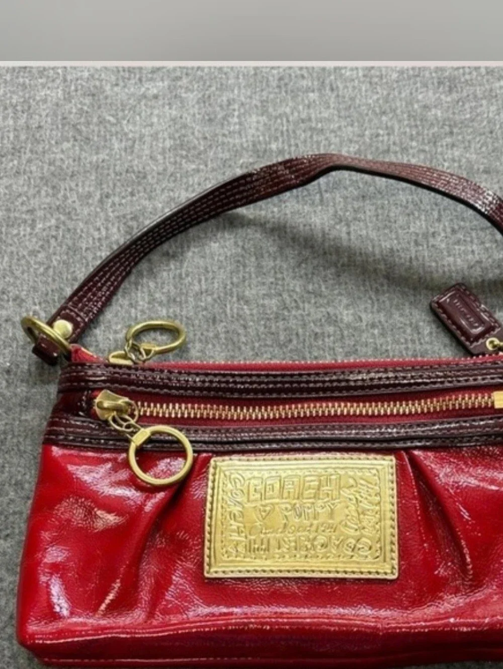 Coach Poppy Red Patent Wristlet with Brass Accents, Minor Callouts, Clean Inside